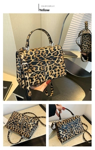 Detail view of leopard print crossbody bag featuring silver metal buckle and top handle