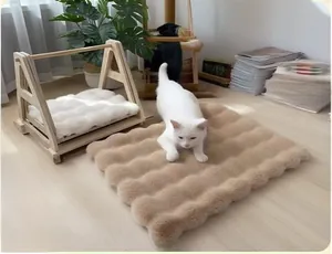 Close-up of thick plush pet cushion with wavy texture on a wooden cat bed frame