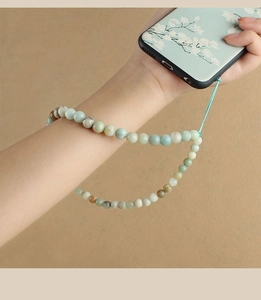 Close-up of beaded turquoise agate phone wrist strap showing natural textures