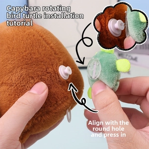 Detail of the snap-on connection mechanism between the Capybara plush and green turtle accessory