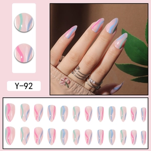 Short nude press-on nails with colorful wavy lines and professional almond shape set