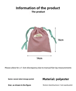Detailed view of red plaid polyester drawstring bag with 16x14cm dimension labels