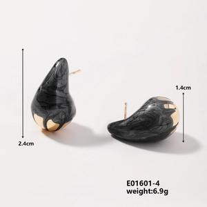 Detailed view of black teardrop earrings with gold accents and 2.4cm size dimensions