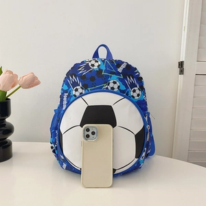 Kids blue football backpack with round soccer pocket shown with a smartphone for scale
