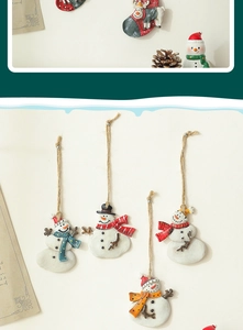 Detail of resin snowman ornaments with colorful scarves and rustic jute strings