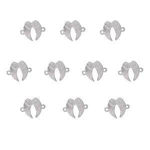 Detail view of 10 pieces silver alloy angel wing pendants with double ring design