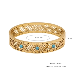 Detail showing dimensions of vintage gold hollow cuff bracelet with blue turquoise inlay