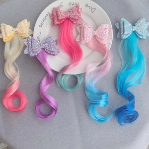 Detail of colorful gradient synthetic hair clips with glitter bows for girls hair accessories