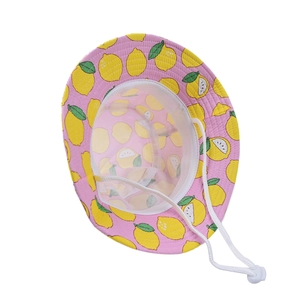 Detail view of pink sun hat with lemon print, mesh lining and adjustable chin strap