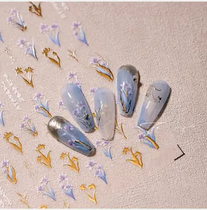 Macro detail of 5D purple floral nail decals with gold foil accents and model M-442 sample