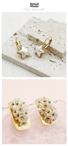 Detailed tile display of gold star earrings with mother-of-pearl and floral cluster studs