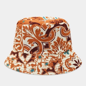 Detail of floral bucket hat showing reinforced stitching and baroque pattern fabric