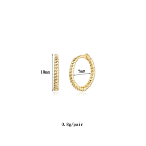 Macro shot showing 10mm gold hoop earrings with twisted texture details and dimensions