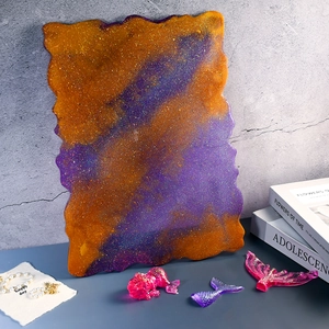 Detailed view of DIY resin tray with orange-purple gradient and irregular edges