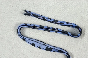 Detailed macro view of purple leopard print straps with high-quality textile texture