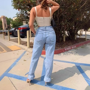 Women's light blue straight leg ripped jeans with casual summer street style look