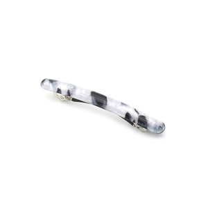 Detailed macro view of long marble pattern hair clip with black and white acetate finish