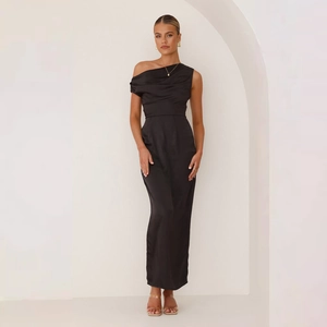 Detail of elegant black one-shoulder satin dress featuring a draped neckline and silky fabric