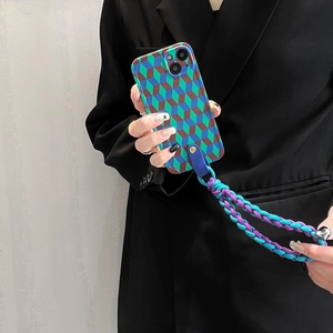Detail of woven crossbody strap and geometric cube pattern phone case for iPhone