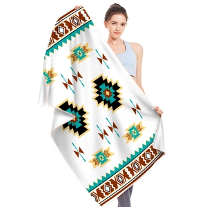Detail of bohemian microfiber beach towel showing geometric patterns and soft texture