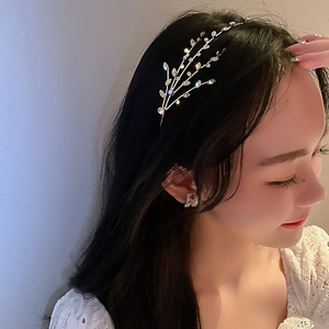 Elegant silver leaf headband with crystals and pearls on model for a graceful style