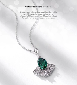 Macro shot of the fan-shaped emerald necklace with brilliant micro-set white cubic zirconia