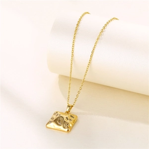 Gold geometric square lava necklace with hammered texture and star zircon details