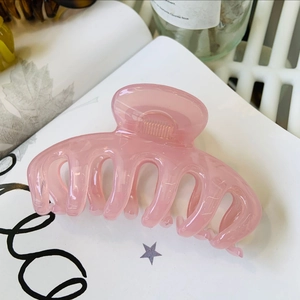 Minimalist large pink flower hair claw clip in translucent resin for thick hair styling