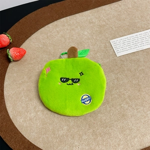 Close-up of green apple plush coin purse with embroidery, zipper and carabiner clip