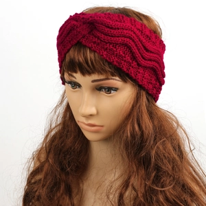Macro detail of wine red cable knit headband with thick yarn and fuzzy fleece lining