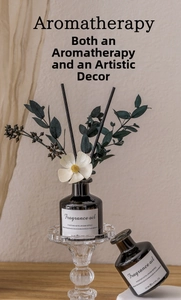 Artistic detail of hotel series 50ml reed diffuser with glass bottle and floral decor