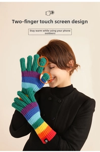 Close-up of rainbow striped knitted gloves with thumb and index finger openings for touchscreens