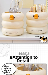 Detail shot of the Judy Swan pen holder featuring a cute duck design and tiered structure