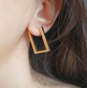 Minimalist 18k gold plated stainless steel square hoop earrings on a female model