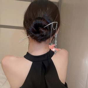 Silver butterfly tassel hair pin styled in a sleek bun, elegant Chinese hair accessory
