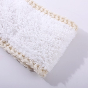Close-up of cable knit headband featuring soft white faux fur lining and beige texture