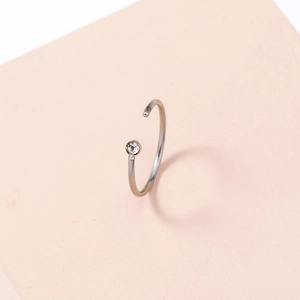 Minimalist silver stainless steel U-shaped nose ring with a clear zircon stone accent