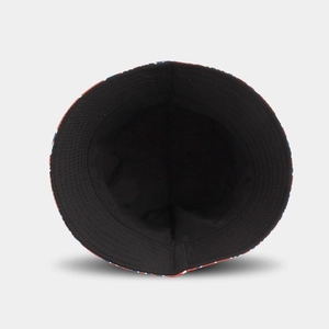 Detail view of the black lining and red, white, and blue patterned edge of a cotton bucket hat