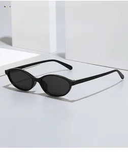 Detail of retro black oval sunglasses on a minimalist geometric architectural background
