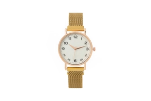 Close-up frontal view of a stylish ladies watch with a golden magnetic mesh strap.