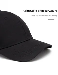 Detail of adjustable curved brim on black baseball cap with wide sun protection design