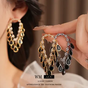 Elegant drop tassel earrings with sparkling cubic zirconia and black teardrop gems