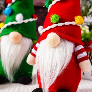 Close-up of red and green Christmas gnomes with knit hats and faux fur beards