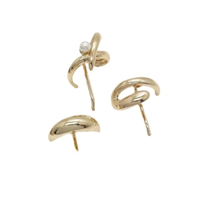 Minimalist gold alloy hair clips and pearl cuff set shown against a white background
