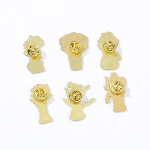 Golden flower coffee cup pins with butterfly clutch backings on white background