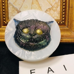 Iridescent Cheshire cat silicone mold for resin art with starry yellow eyes and 3D textures