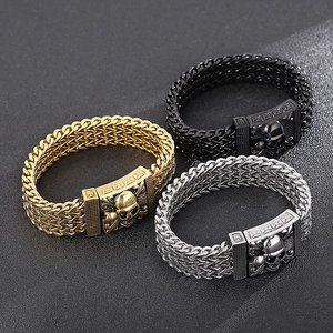 Men's hip hop skull bracelets in gold, silver, and black finishes on a matte background