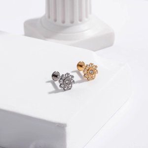 Macro shot of G23 titanium flower stud earrings with sparkling clear rhinestones
