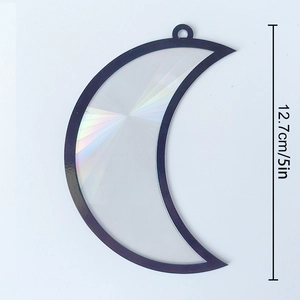 Close-up of a 5-inch moon-shaped suncatcher with rainbow holographic center effect