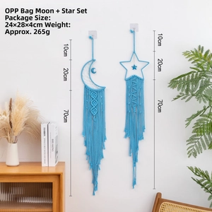 Detail of moon and star woven cotton tapestry wall hanging in light blue color